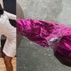 drama-as-wedding-guest-gifts-bride-wrapped-cutlass-photo