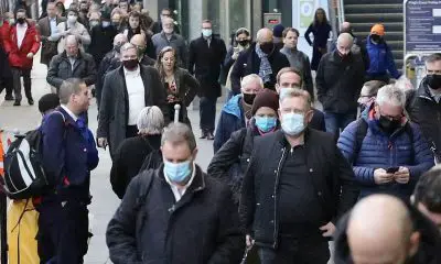 Commuters walk through London King