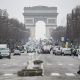 France will introduce new vaccine passport rules for visitors to cafes and restaurants from next week, the government announced tonight. Pictured: Pedestrians walk near The Arc de Triomphe in Paris, France, 17 January 2022