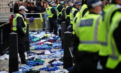 In London, dozens of health workers were seen throwing their scrubs at police officers outside Downing Street (pictured), while others dumped their uniforms on the ground by Trafalgar Square