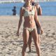 Beach babe: Alessandra Ambrosio showed off her fit figure in a bikini while playing beach volleyball on Sunday in Santa Monica, California