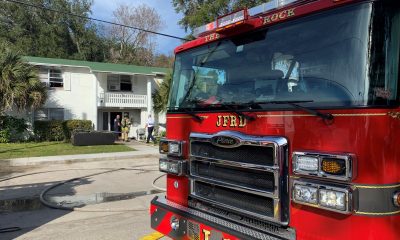 Young child, man rushed to hospital after Woodland Acres apartment fire