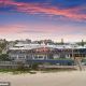 Lifesavers threw a boozy party at Coolum Surf Club (pictured) the night before resuming a search for a missing man swept out to sea as his devastated family sat on the beach
