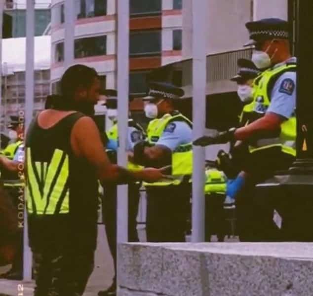 Kiwi police have been spotted joining a game of rock paper scissors with a demonstrator on the frontline of New Zealand