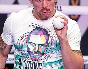Oleksandr Usyk juggles with a ball in training