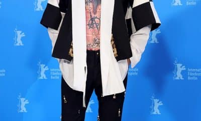 Rock and roll: Machine Gun Kelly bared his tattooed chest in checked jacket as he stepped out for the premiere of his new film Taurus at Berlin International Film Festival on Sunday