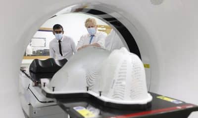 Prime Minister Boris Johnson and the Chancellor of the Exchequer Rishi Sunak look at a CT Scanner as they visit the Kent Oncology Centre in Maidstone