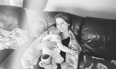 Sweet moment: Bindi Irwin cuddled up with her 10-month-old daughter Grace Warrior to watch the Sunday