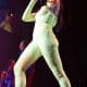 Distinctive look: Dua Lipa rocked her fifth concert tour at Bridgestone Arena in Nashville, Tennessee, on Monday night wearing a striking yellow catsuit