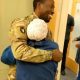 Nigerian woman sheds tears of joy as her husband, who is serving in the US Army, surprises her at work after 11 months of being deployed overseas (video) - YabaLeftOnline