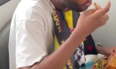 Nigerian man enjoy hefty plate of Eba and Egusi soup inside moving BRT bus (Video) - YabaLeftOnline