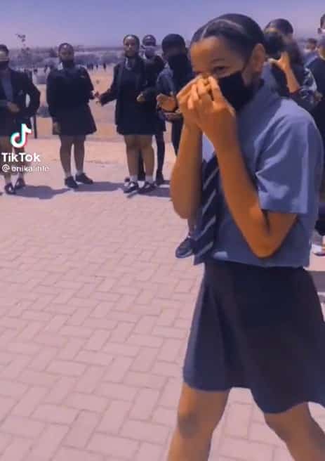 Moment secondary school student goes on her knees to propose to another female student while other students cheer sparks outrage online (video) - YabaLeftOnline