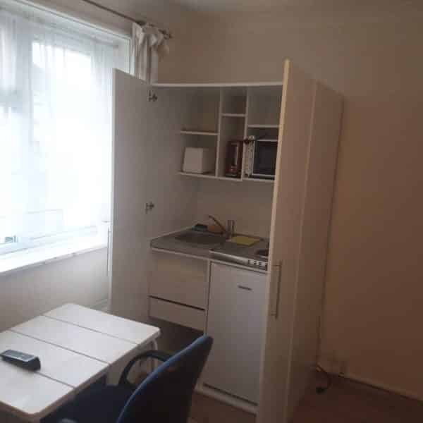 "Lagos landlords will soon copy this" – Reactions as man shares photo of a London apartment with a kitchen inside its wardrobe. - YabaLeftOnline
